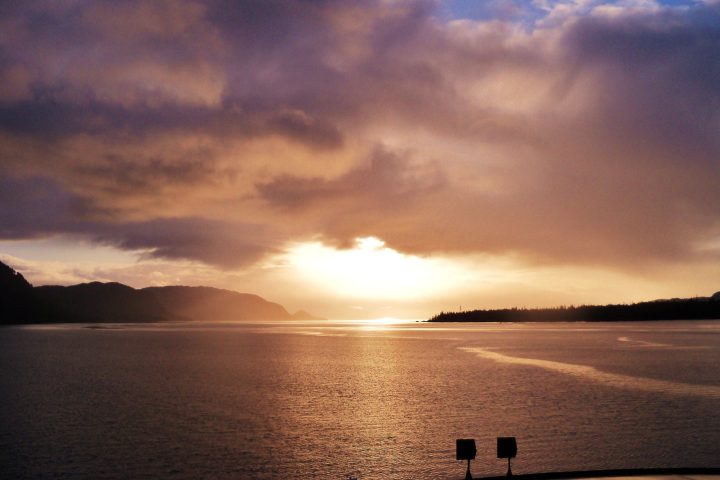 a sunset over a body of water