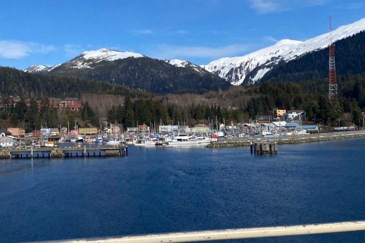 a body of water with a mountain in the background