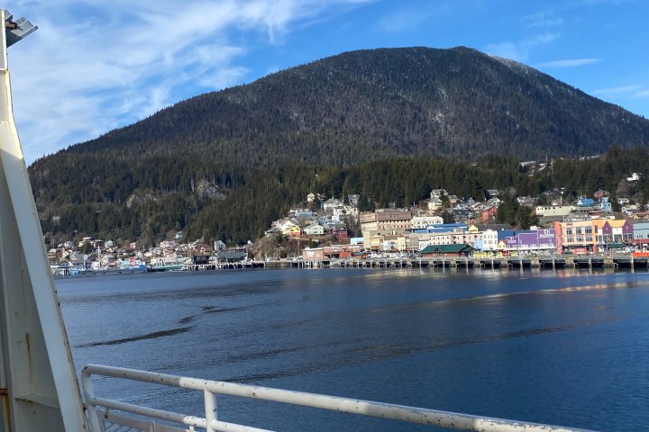 a body of water with a mountain in the background