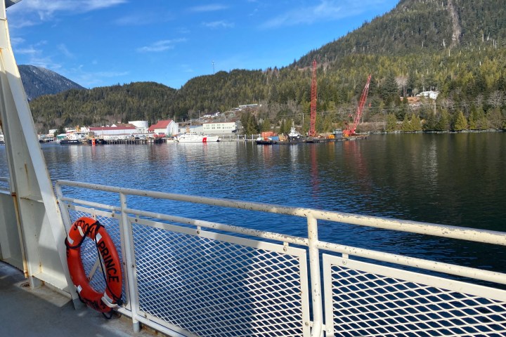 a boat is docked next to a body of water