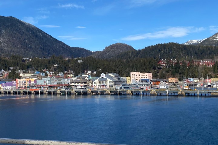 a boat is docked next to a body of water