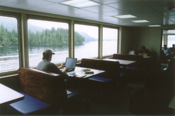 Passengers sit in the newly built M/V POW during her first run