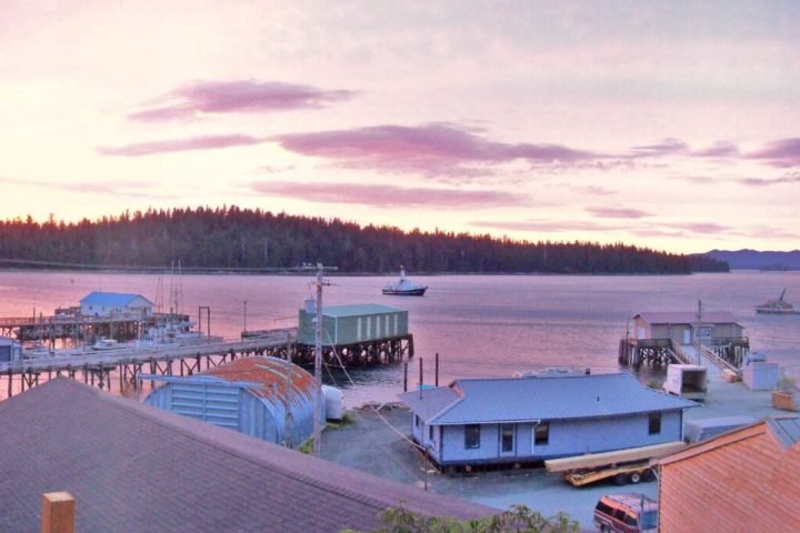a wooden pier next to a body of water
