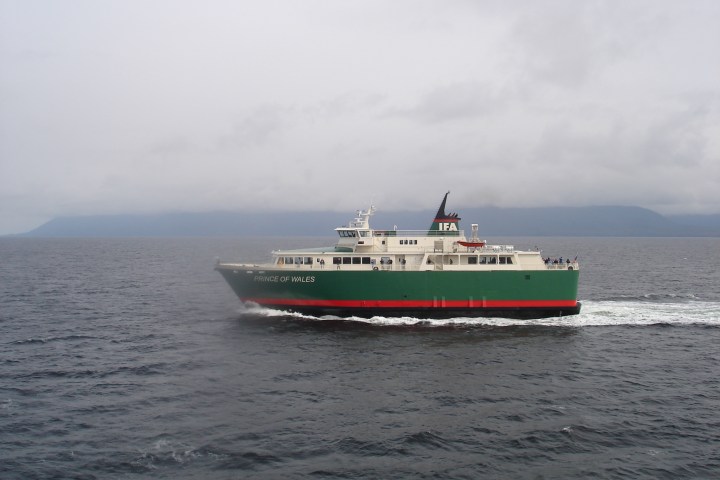 a small boat in a large body of water