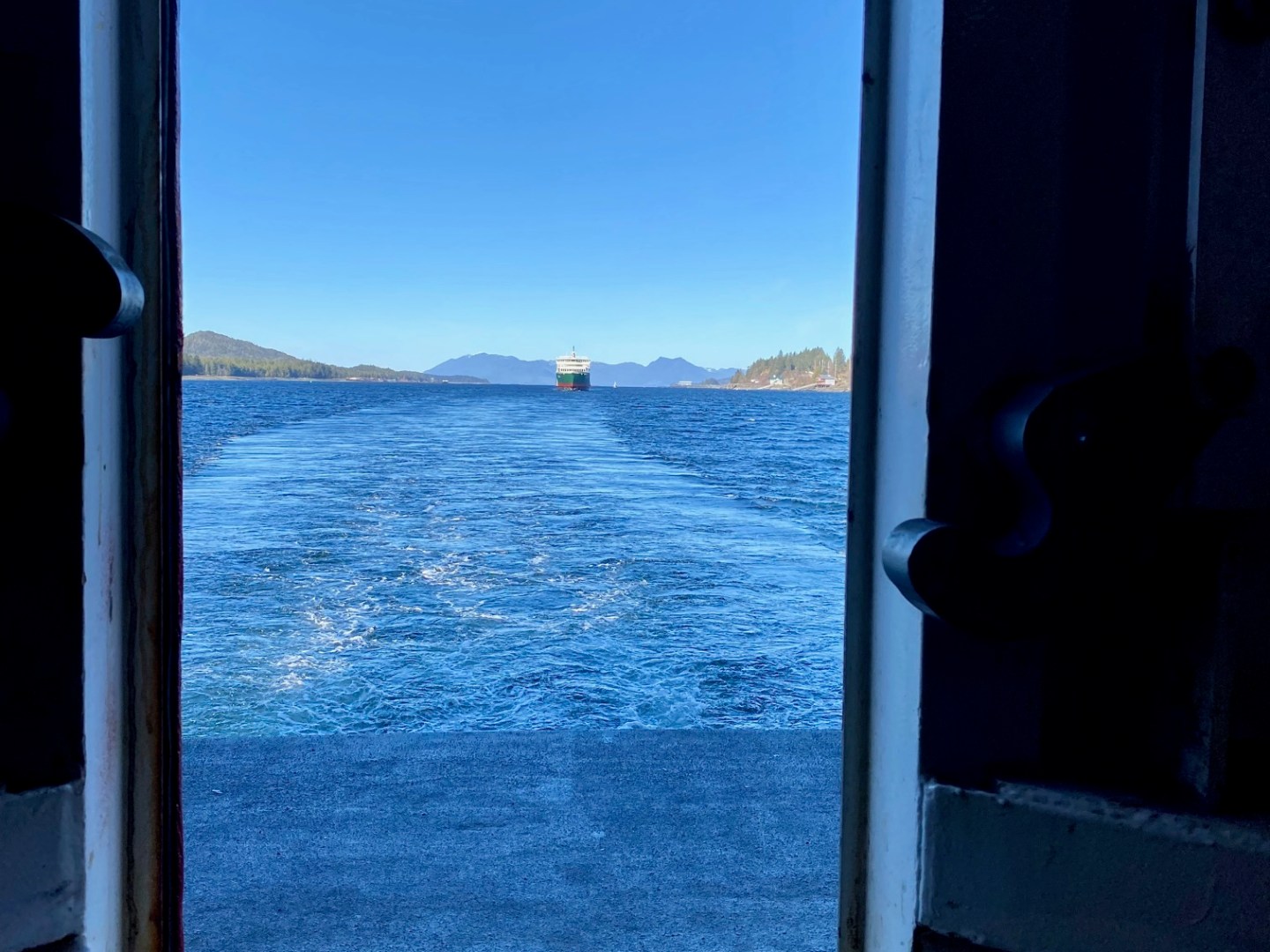 a view of a body of water in front of a window