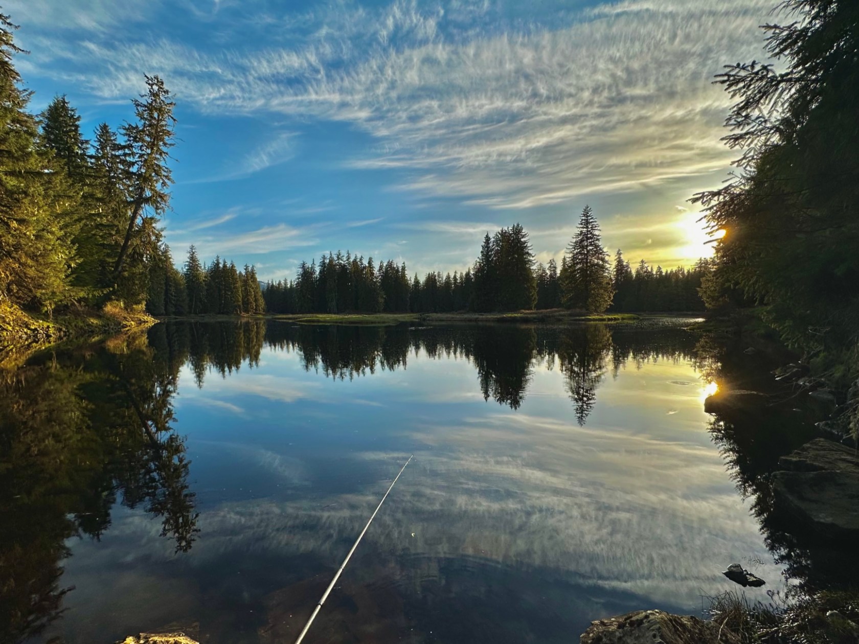 a sunset over a body of water