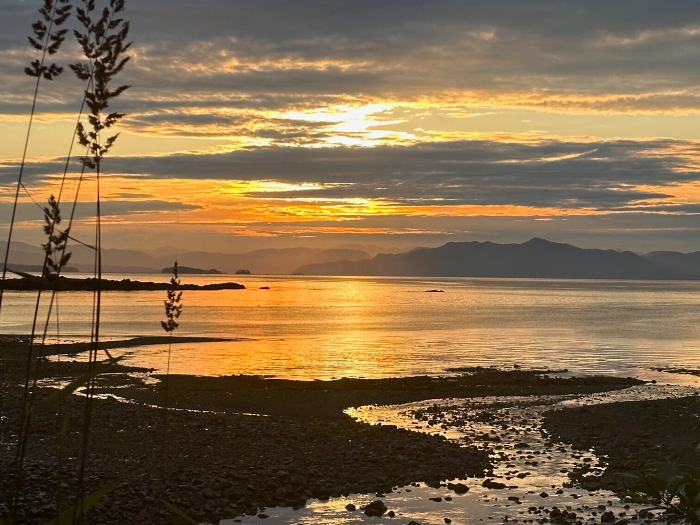 a sunset over a body of water