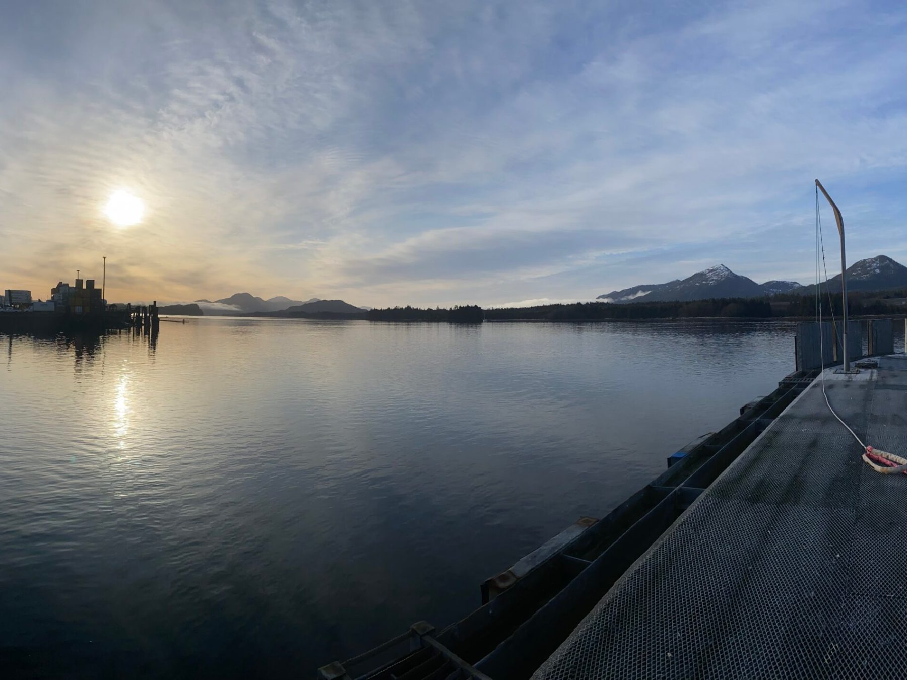 a boat is docked next to a body of water